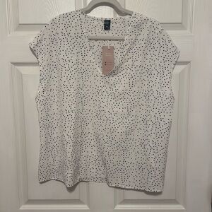 White and black polka dot blouse
